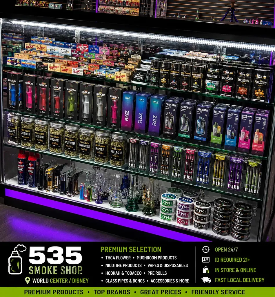 Product display at 535 Smoke Shop — THCA flower jars, RAZ and Geek Bar vapes, hookah bowls, torches, and glass